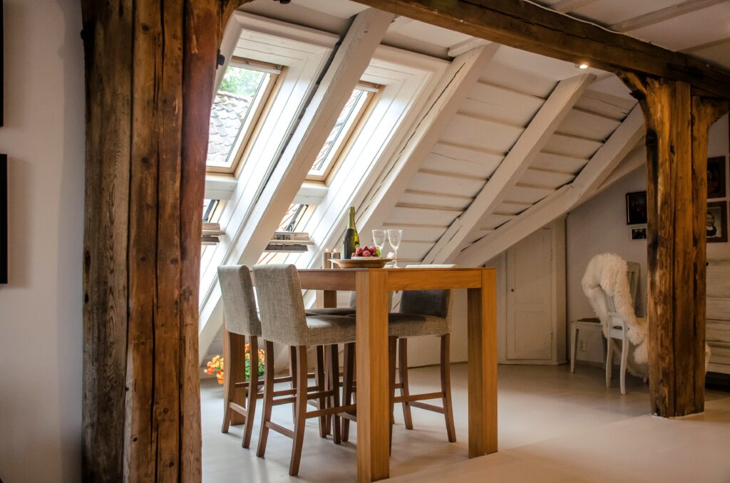 Wooden table and slanted ceiling