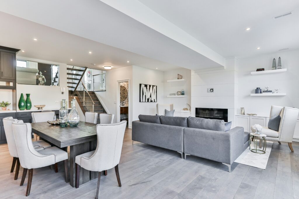 Grey living room with dining table.