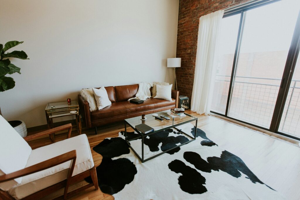 Living room with a cow print rug